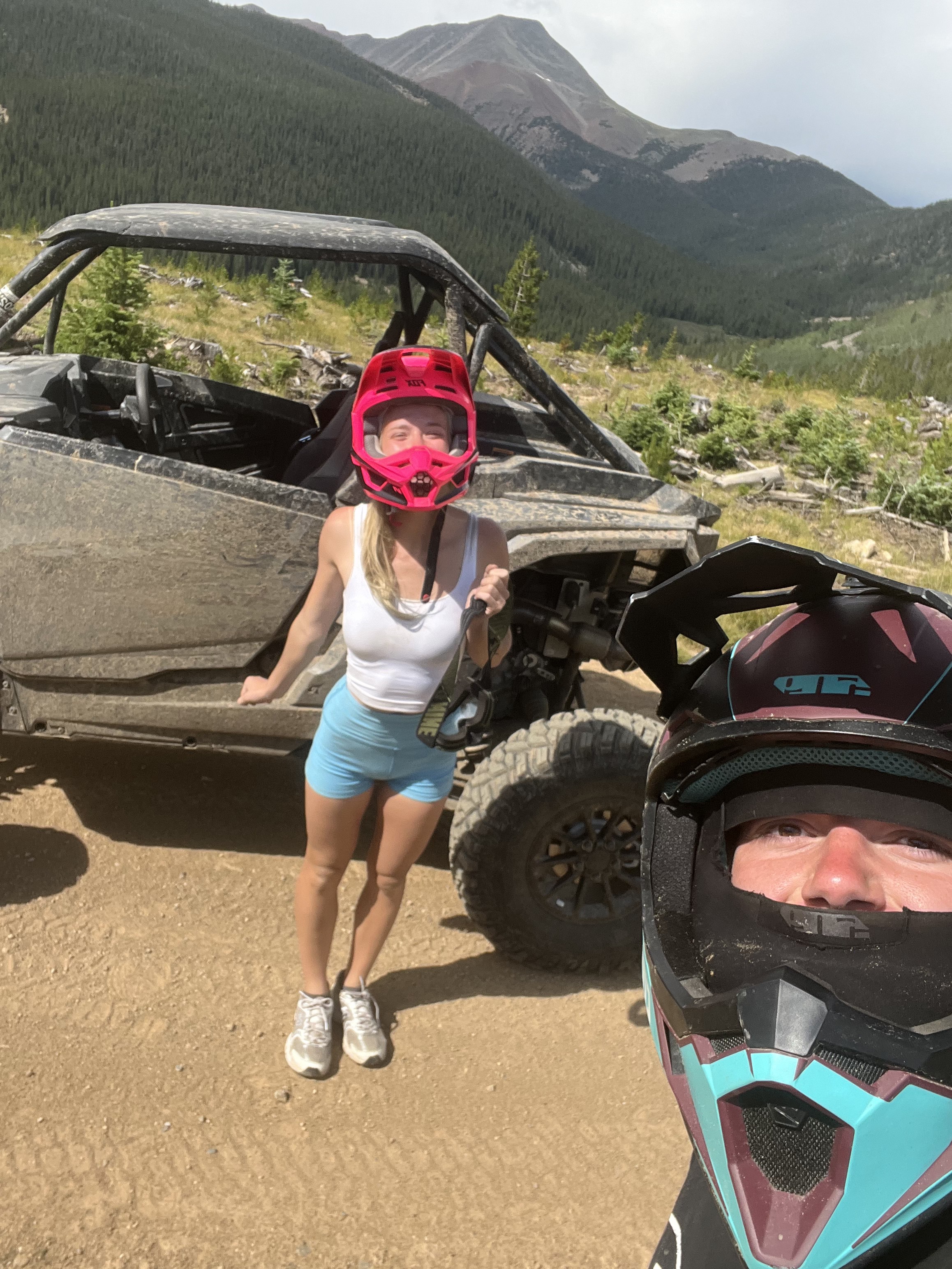Ethan Bible and Sydnee riding a SXS